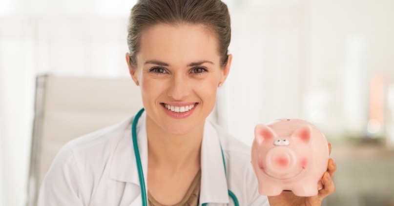 Doctor with Piggy bank - Physician Disability Insurance - Specialized Disability Insurance Services in NYC